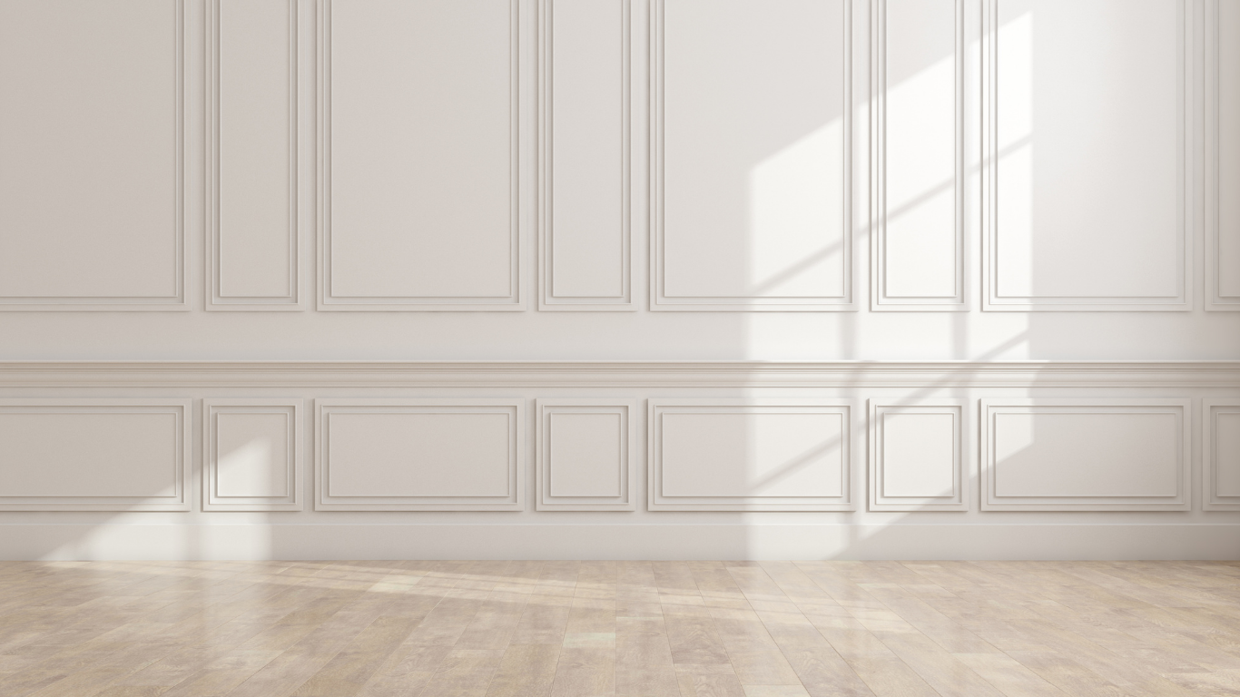 Sunlight across a home's pale panelled walls and wooden floor