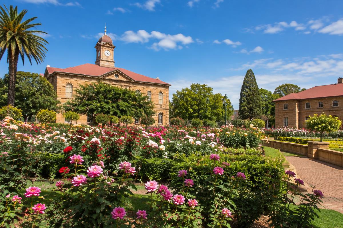Rose garden and sandstone buildings in Bloemfontein