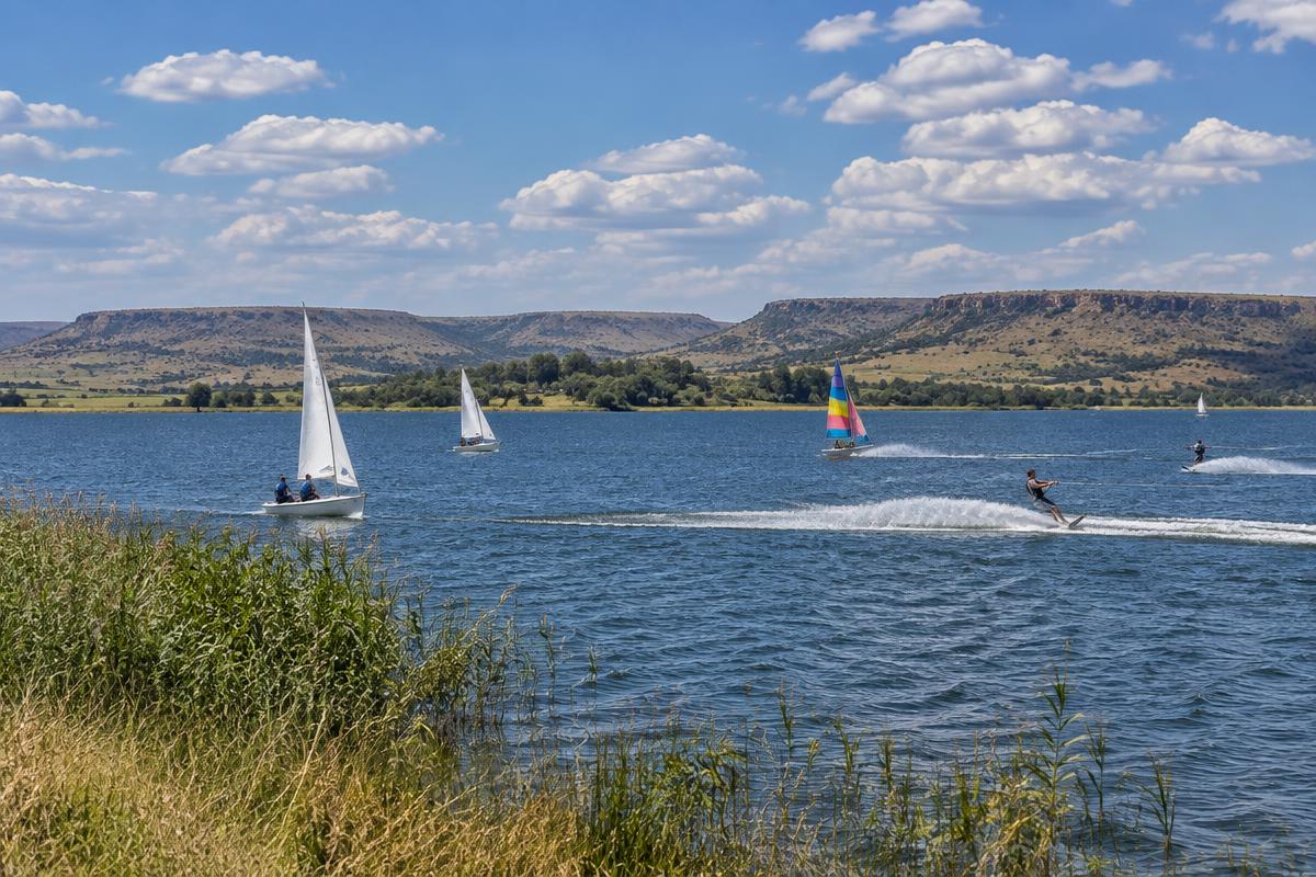 Potchefstroom Dam with boats and highveld sky